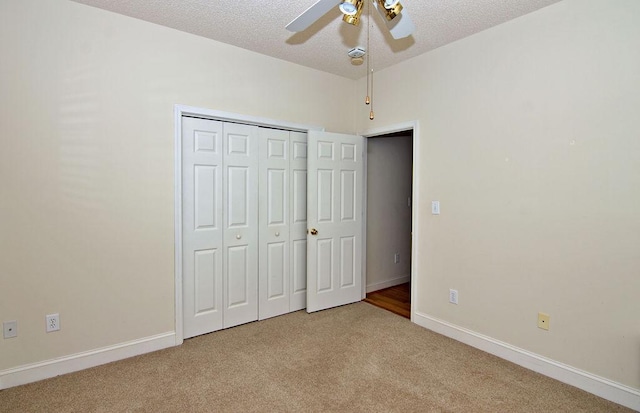 200 Smithfield Dr, Anderson, SC 29621 - unfurnished bedroom featuring light carpet, a textured ceiling, a closet, and a ceiling fan