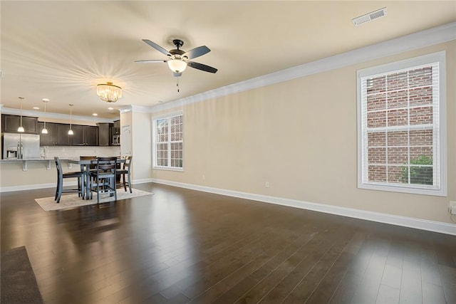 137 Golden Eagle Ln, Anderson, SC 29621 - living room featuring a ceiling fan, crown molding, dark wood-type flooring, and a chandelier