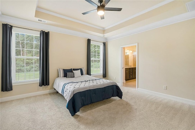 137 Golden Eagle Ln, Anderson, SC 29621 - bedroom with a tray ceiling, ornamental molding, light carpet, ensuite bath, and ceiling fan
