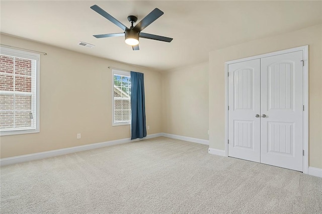 137 Golden Eagle Ln, Anderson, SC 29621 - unfurnished bedroom with light carpet, a closet, and ceiling fan