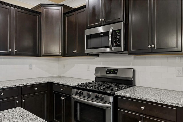 137 Golden Eagle Ln, Anderson, SC 29621 - kitchen featuring stainless steel appliances, tasteful backsplash, and light stone countertops