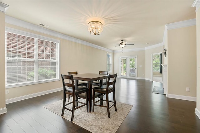 137 Golden Eagle Ln, Anderson, SC 29621 - dining space with ceiling fan, a chandelier, dark wood-style floors, and ornamental molding