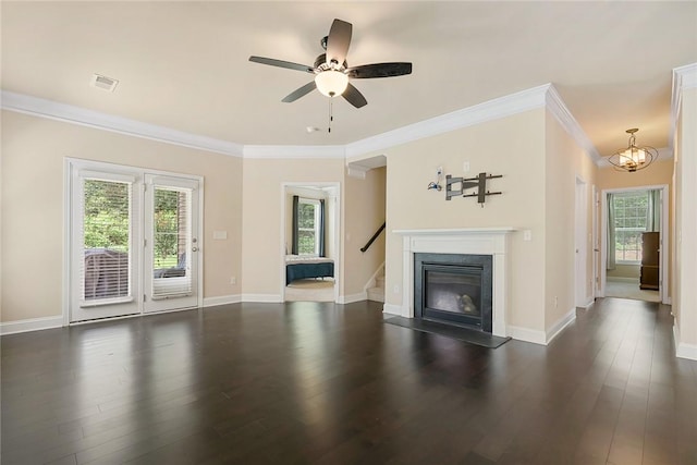 137 Golden Eagle Ln, Anderson, SC 29621 - unfurnished living room featuring dark wood finished floors, ornamental molding, ceiling fan, stairway, and a glass covered fireplace