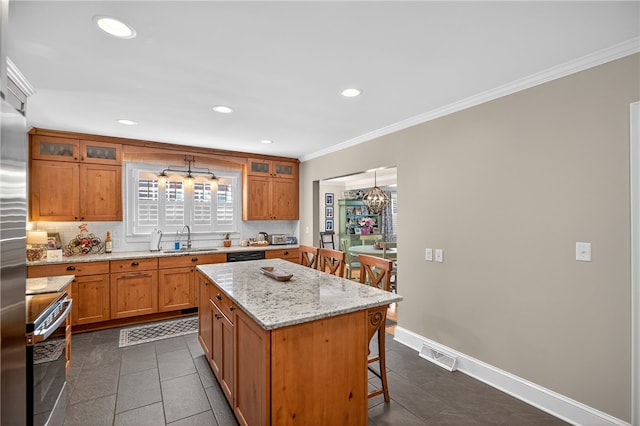 260 Riggs Dr, Clemson, SC 29631 - kitchen featuring stove, decorative backsplash, a kitchen bar, a center island, and crown molding