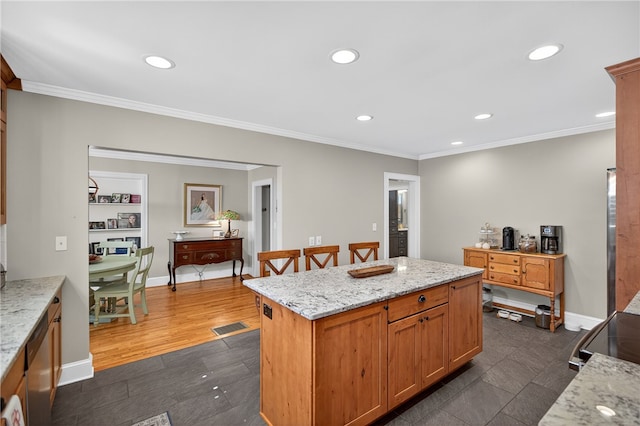 260 Riggs Dr, Clemson, SC 29631 - kitchen featuring recessed lighting, stainless steel dishwasher, ornamental molding, a kitchen island, and light stone counters