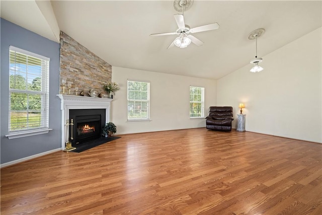 433 Shore Line Dr, Anderson, SC 29626 - unfurnished living room with a ceiling fan, healthy amount of natural light, wood finished floors, a fireplace with flush hearth, and high vaulted ceiling