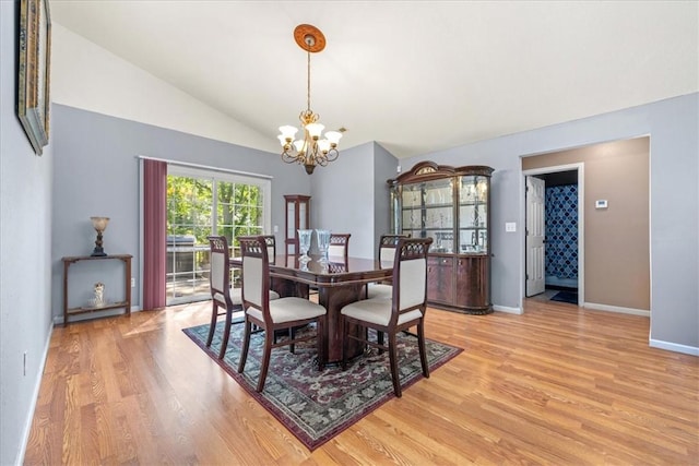 433 Shore Line Dr, Anderson, SC 29626 - dining area with a chandelier, light wood-style floors, and vaulted ceiling