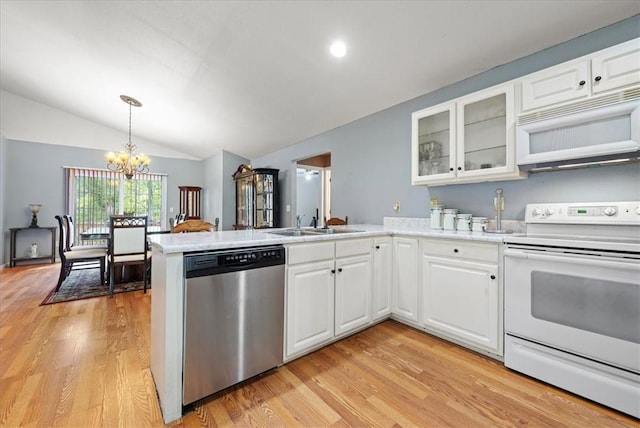 433 Shore Line Dr, Anderson, SC 29626 - kitchen featuring white appliances, a peninsula, light wood finished floors, lofted ceiling, and a chandelier