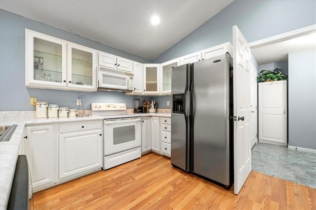 433 Shore Line Dr, Anderson, SC 29626 - kitchen featuring white appliances, lofted ceiling, white cabinets, light countertops, and light wood-type flooring