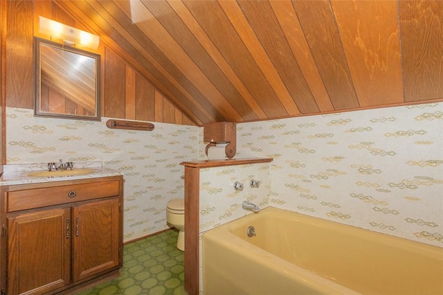 205 James St, Anderson, SC 29625 - bathroom featuring lofted ceiling, a bath, vanity, and wallpapered walls