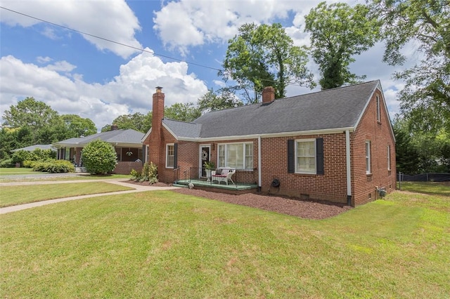 205 James St, Anderson, SC 29625 - view of front of house featuring a chimney, brick siding, a front lawn, and crawl space