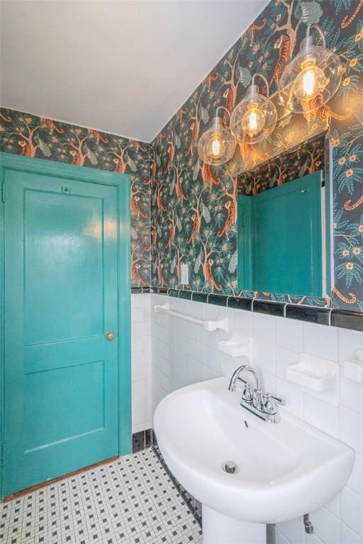 205 James St, Anderson, SC 29625 - bathroom with wallpapered walls, wainscoting, tile walls, and tile patterned floors