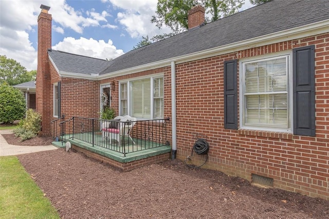 205 James St, Anderson, SC 29625 - view of property exterior featuring crawl space, a chimney, brick siding, and a shingled roof