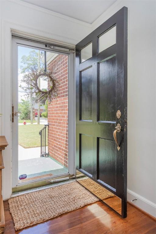 205 James St, Anderson, SC 29625 - foyer featuring wood finished floors and ornamental molding