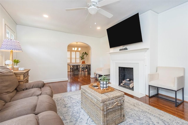 205 James St, Anderson, SC 29625 - living room featuring arched walkways, ceiling fan, wood finished floors, recessed lighting, and a fireplace with flush hearth