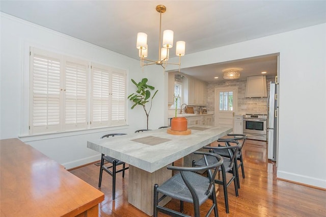 205 James St, Anderson, SC 29625 - kitchen with appliances with stainless steel finishes, light countertops, wood finished floors, and a kitchen bar