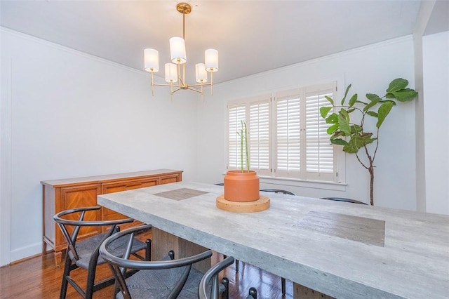 205 James St, Anderson, SC 29625 - dining area with a chandelier, crown molding, and dark wood-type flooring