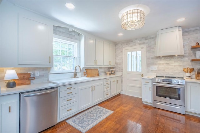 205 James St, Anderson, SC 29625 - kitchen with appliances with stainless steel finishes, tasteful backsplash, light countertops, white cabinets, and recessed lighting