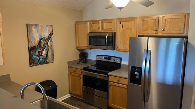 1132 Harts Ridge Dr, Seneca, SC 29678 - kitchen featuring stainless steel appliances, ceiling fan, dark wood-style flooring, light countertops, and a textured ceiling