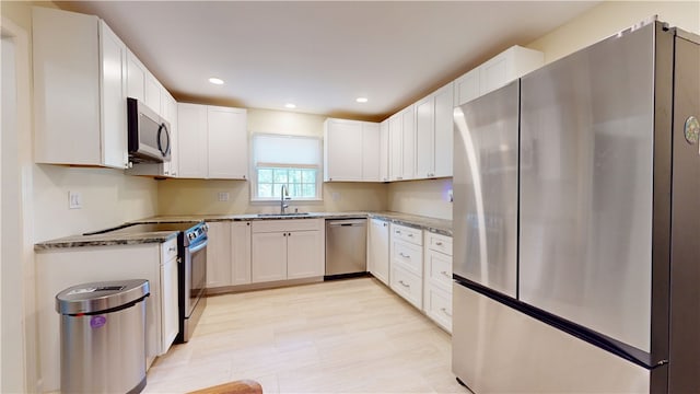 203 Ashley Rd, Clemson, SC 29631 - kitchen with stainless steel appliances, white cabinetry, recessed lighting, and stone countertops