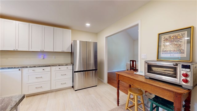 203 Ashley Rd, Clemson, SC 29631 - kitchen with freestanding refrigerator, white cabinetry, light wood-style floors, and recessed lighting