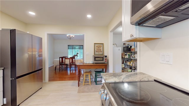 203 Ashley Rd, Clemson, SC 29631 - kitchen featuring appliances with stainless steel finishes, white cabinets, light stone counters, recessed lighting, and light wood-style floors