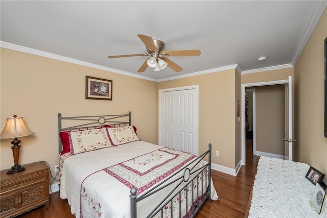 1339 Griffin Mill Rd, Easley, SC 29640 - bedroom with ornamental molding, dark wood-style flooring, a closet, and a ceiling fan