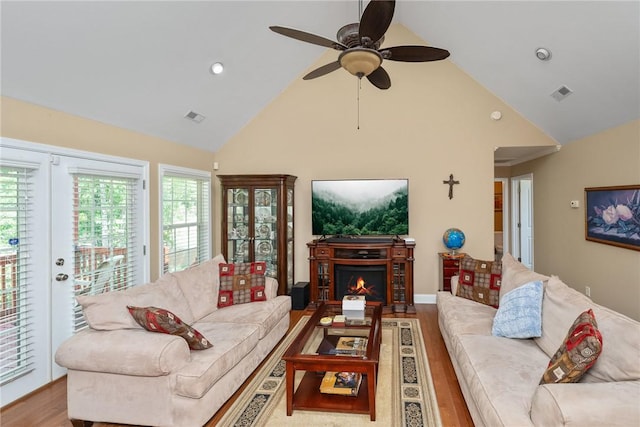 1339 Griffin Mill Rd, Easley, SC 29640 - living area with high vaulted ceiling, a ceiling fan, wood finished floors, a warm lit fireplace, and recessed lighting