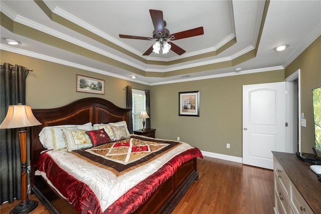 1339 Griffin Mill Rd, Easley, SC 29640 - bedroom featuring a tray ceiling, wood finished floors, crown molding, and ceiling fan
