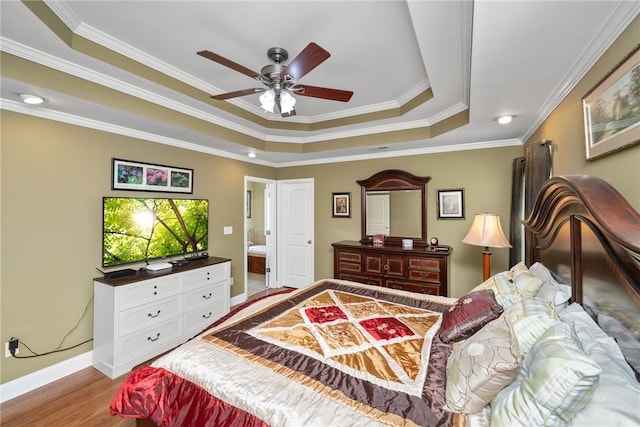 1339 Griffin Mill Rd, Easley, SC 29640 - bedroom featuring a raised ceiling, crown molding, wood finished floors, and a ceiling fan