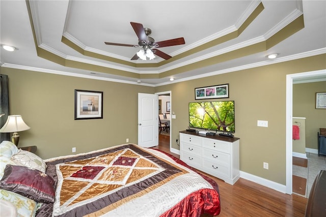 1339 Griffin Mill Rd, Easley, SC 29640 - bedroom featuring a raised ceiling, wood finished floors, and crown molding