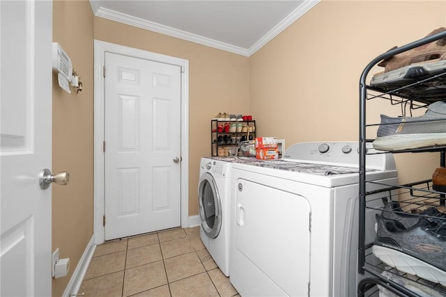 1339 Griffin Mill Rd, Easley, SC 29640 - washroom featuring washer and clothes dryer, ornamental molding, and light tile patterned flooring