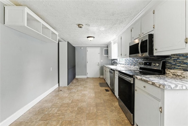 159 Rabbit Rd, Pickens, SC 29671 - kitchen featuring appliances with stainless steel finishes, light countertops, decorative backsplash, a textured ceiling, and open shelves