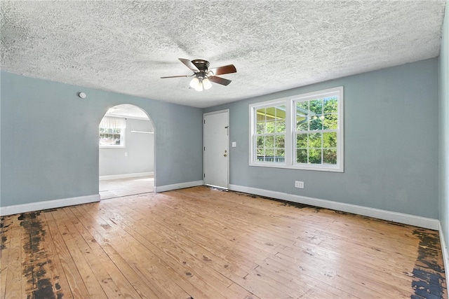 159 Rabbit Rd, Pickens, SC 29671 - spare room featuring ceiling fan, arched walkways, hardwood / wood-style flooring, and a textured ceiling