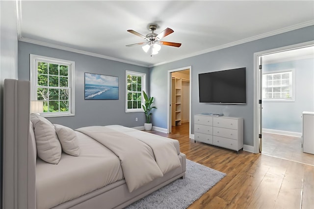 159 Rabbit Rd, Pickens, SC 29671 - bedroom with a spacious closet, crown molding, wood finished floors, ceiling fan, and a closet
