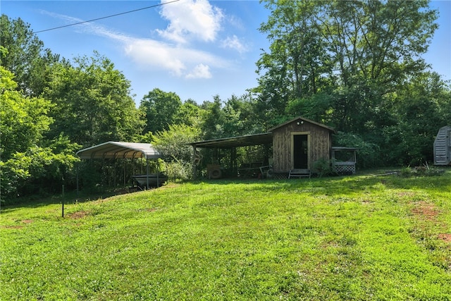 159 Rabbit Rd, Pickens, SC 29671 - view of green lawn with a storage unit and a carport