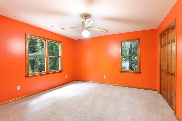 111 Halifax Rd, Easley, SC 29642 - unfurnished bedroom with light carpet, a closet, and ceiling fan