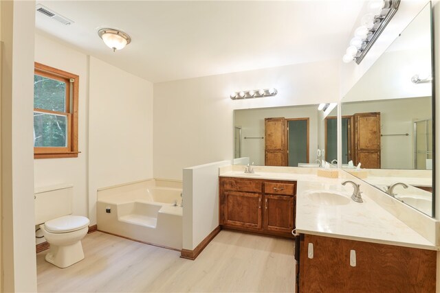 111 Halifax Rd, Easley, SC 29642 - full bathroom with wood finished floors, double vanity, a bath, and a shower with door