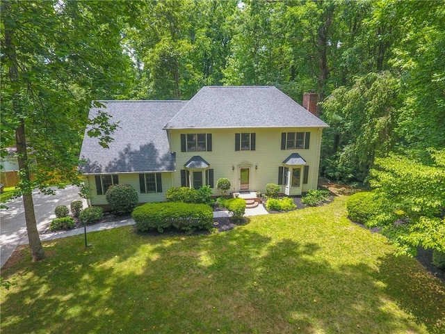 111 Halifax Rd, Easley, SC 29642 - colonial home with a chimney, a front lawn, and roof with shingles