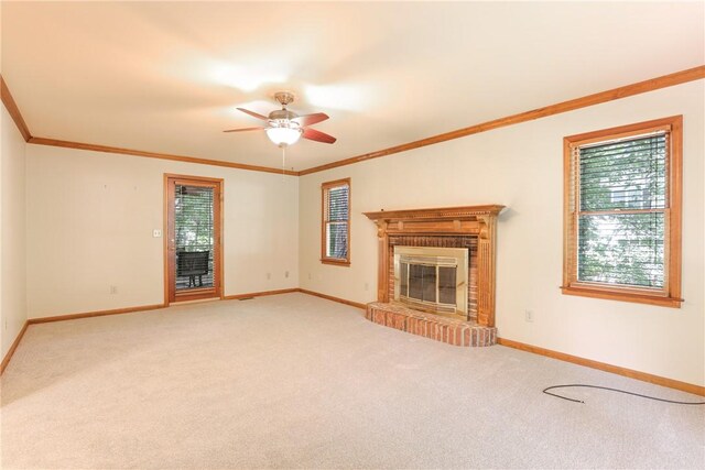 111 Halifax Rd, Easley, SC 29642 - unfurnished living room with light colored carpet, crown molding, a ceiling fan, and a brick fireplace