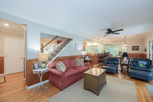 227 E Clearwater Shores Rd, Fair Play, SC 29643 - living area featuring ornamental molding, a wainscoted wall, a ceiling fan, stairs, and wood finished floors