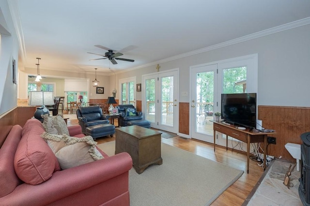 227 E Clearwater Shores Rd, Fair Play, SC 29643 - living room featuring ornamental molding, a wainscoted wall, a ceiling fan, and light wood finished floors