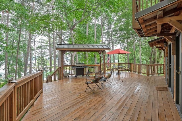 227 E Clearwater Shores Rd, Fair Play, SC 29643 - wooden terrace featuring outdoor dining space, area for grilling, and view of wooded area