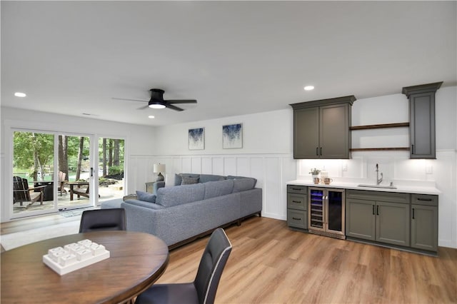 36 Mizzen Ln, Salem, SC 29676 - dining space featuring wine cooler, a ceiling fan, wainscoting, light wood-type flooring, and a decorative wall
