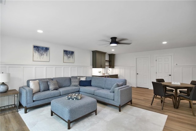 36 Mizzen Ln, Salem, SC 29676 - living room featuring a decorative wall, a ceiling fan, light wood-type flooring, wainscoting, and recessed lighting