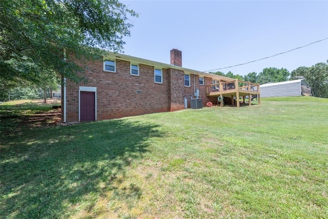 208 Springview Dr, Anderson, SC 29625 - back of house with a chimney, a lawn, and brick siding
