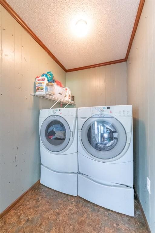 208 Springview Dr, Anderson, SC 29625 - washroom with washing machine and dryer, crown molding, a textured ceiling, and wood walls