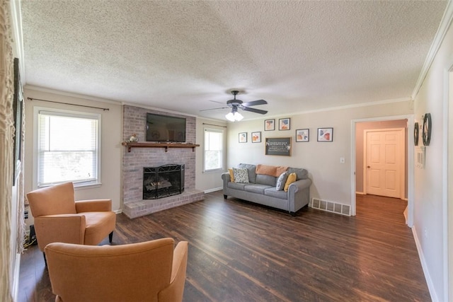 208 Springview Dr, Anderson, SC 29625 - living area with a textured ceiling, wood finished floors, ceiling fan, a brick fireplace, and ornamental molding