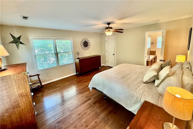 203 Catawbah Rd, Clemson, SC 29631 - bedroom featuring dark wood-type flooring, multiple windows, a ceiling fan, and connected bathroom