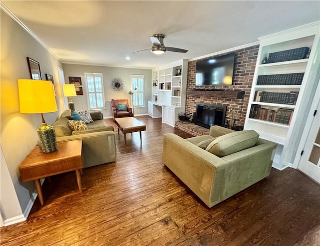 203 Catawbah Rd, Clemson, SC 29631 - living room featuring wood finished floors, built in features, a ceiling fan, ornamental molding, and a fireplace